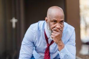 Testosterone and Male Pattern Baldness The Bald Truth, a bald man sitting